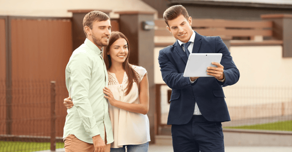 sales consultants speaking with potential home buyers