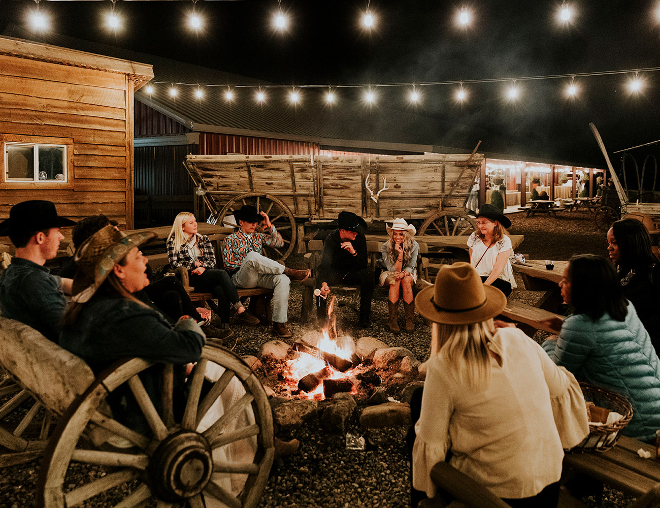 Group of Employees Gathered Around Campfire